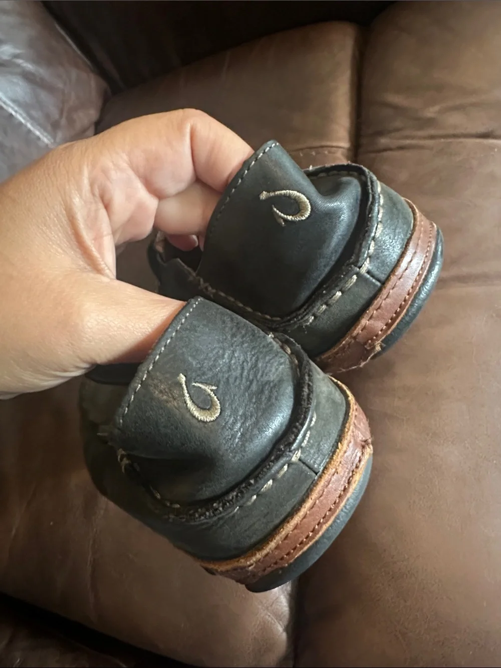 OluKai Men's Black Slip-On Loafers with Brown Trim